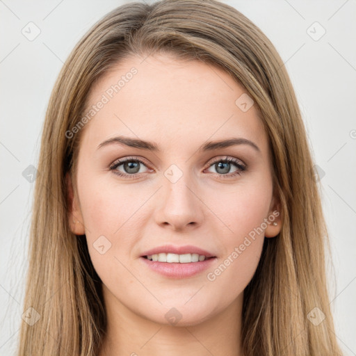 Joyful white young-adult female with long  brown hair and green eyes