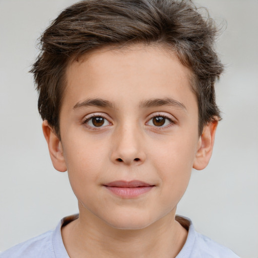 Joyful white child male with short  brown hair and brown eyes