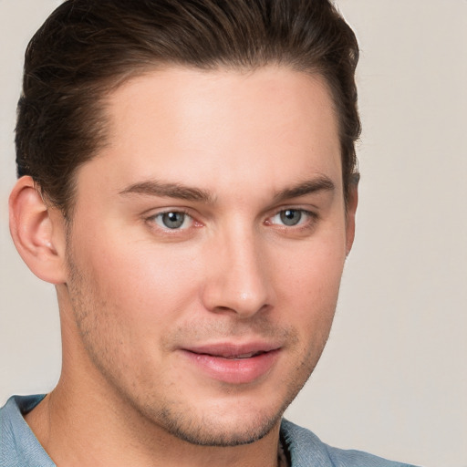 Joyful white young-adult male with short  brown hair and brown eyes