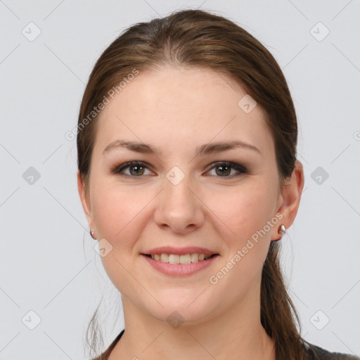 Joyful white young-adult female with medium  brown hair and grey eyes