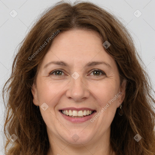 Joyful white adult female with long  brown hair and brown eyes