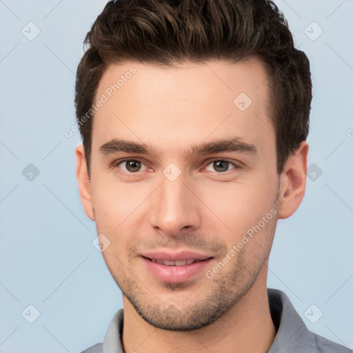 Joyful white young-adult male with short  brown hair and brown eyes