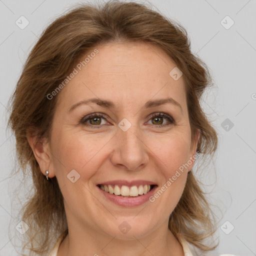 Joyful white adult female with medium  brown hair and grey eyes