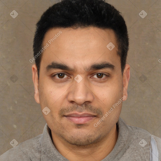 Joyful latino young-adult male with short  black hair and brown eyes