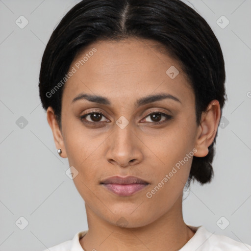 Joyful latino young-adult female with short  black hair and brown eyes