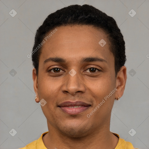 Joyful latino young-adult male with short  brown hair and brown eyes