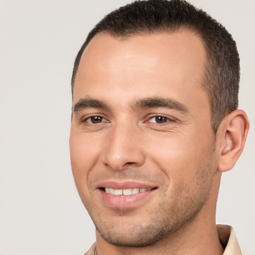 Joyful white young-adult male with short  brown hair and brown eyes