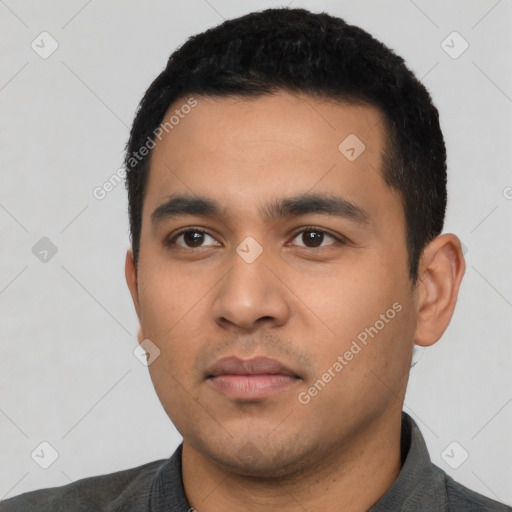 Neutral latino young-adult male with short  black hair and brown eyes