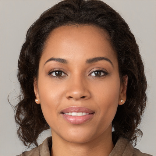 Joyful white young-adult female with long  brown hair and brown eyes