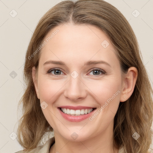 Joyful white young-adult female with long  brown hair and grey eyes