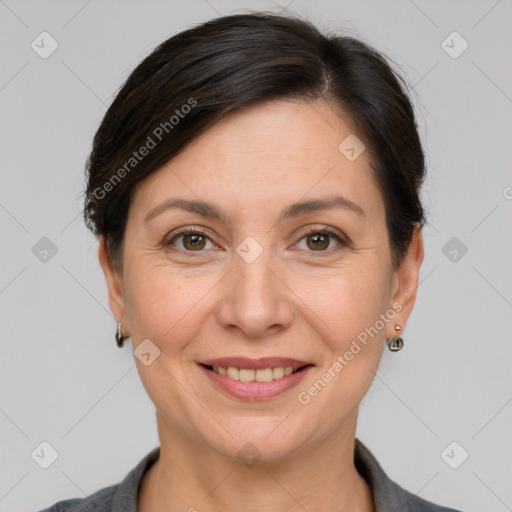 Joyful white adult female with short  brown hair and brown eyes