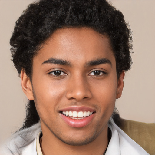 Joyful latino young-adult male with short  brown hair and brown eyes