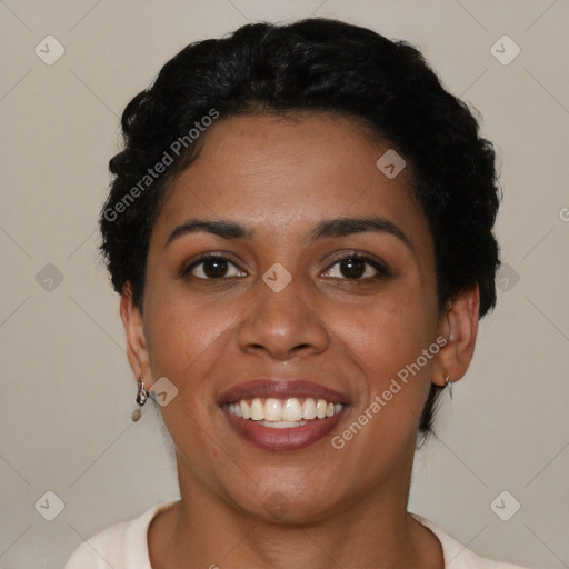 Joyful black young-adult female with short  brown hair and brown eyes