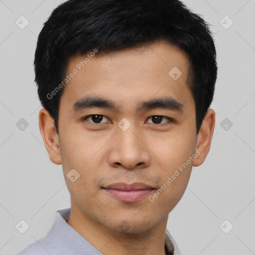 Joyful asian young-adult male with short  black hair and brown eyes