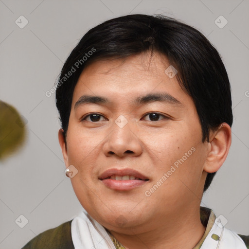 Joyful asian young-adult male with short  black hair and brown eyes