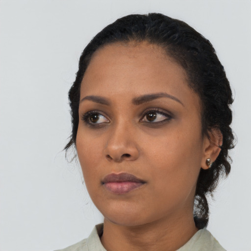 Neutral black young-adult female with long  black hair and brown eyes