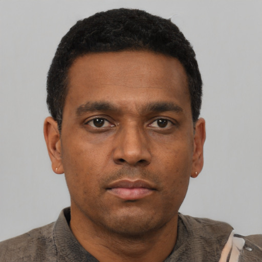 Neutral latino adult male with short  black hair and brown eyes