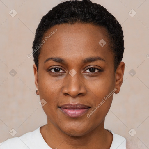 Joyful black young-adult female with short  black hair and brown eyes