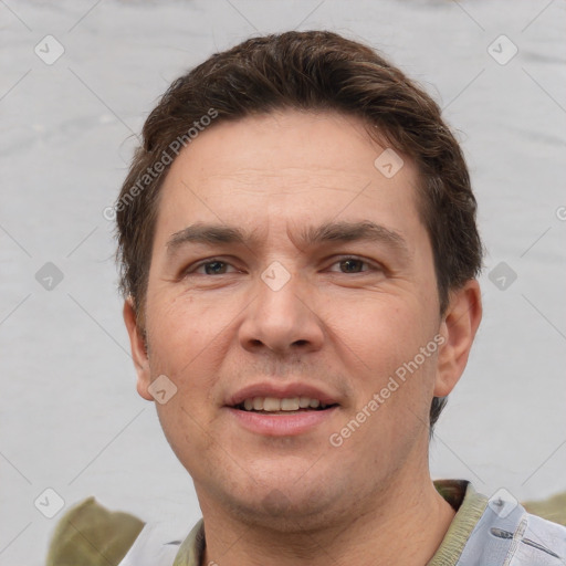 Joyful white adult male with short  brown hair and grey eyes