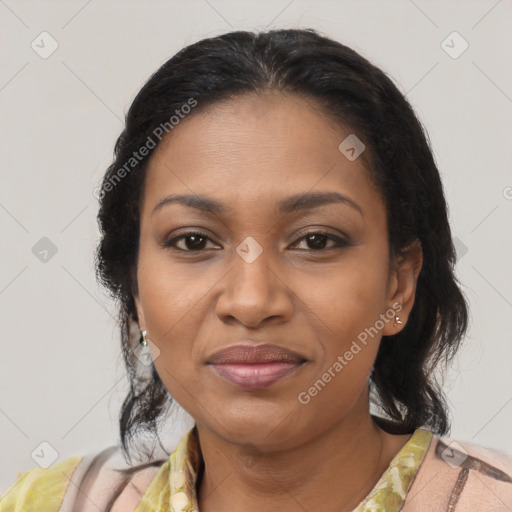 Joyful black adult female with medium  brown hair and brown eyes