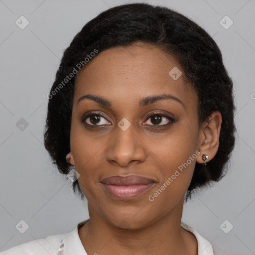 Joyful black young-adult female with medium  black hair and brown eyes