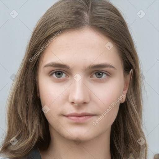 Neutral white young-adult female with long  brown hair and brown eyes