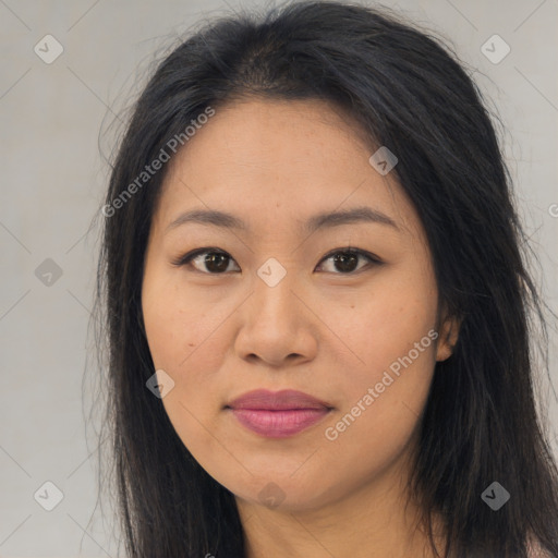 Joyful asian young-adult female with long  brown hair and brown eyes