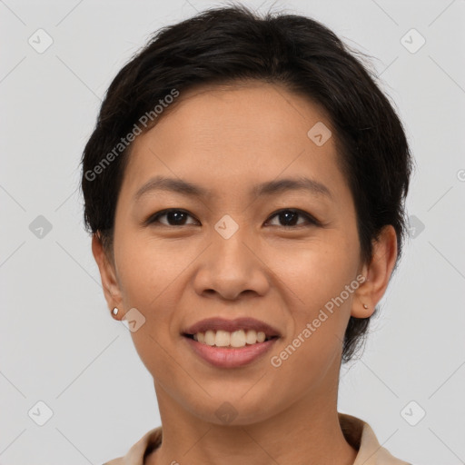 Joyful asian young-adult female with short  brown hair and brown eyes