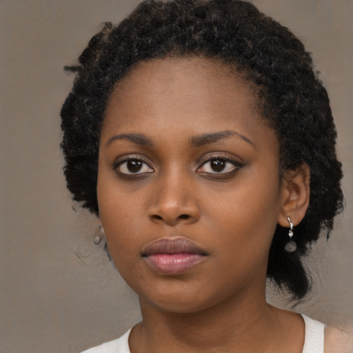 Neutral black young-adult female with medium  black hair and brown eyes