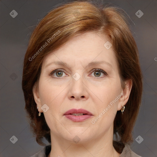 Joyful white adult female with medium  brown hair and grey eyes