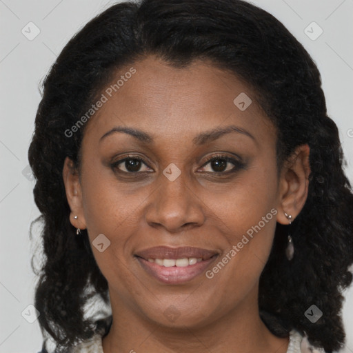 Joyful latino adult female with medium  brown hair and brown eyes