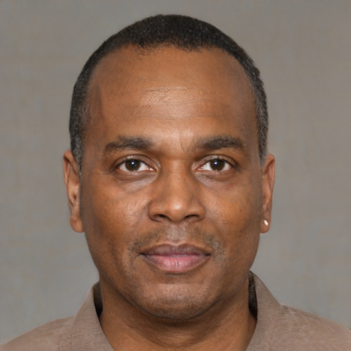 Neutral black adult male with short  black hair and brown eyes
