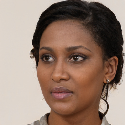 Neutral black young-adult female with short  brown hair and brown eyes