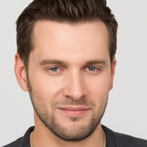 Joyful white young-adult male with short  brown hair and brown eyes