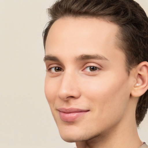 Joyful white young-adult male with medium  brown hair and brown eyes