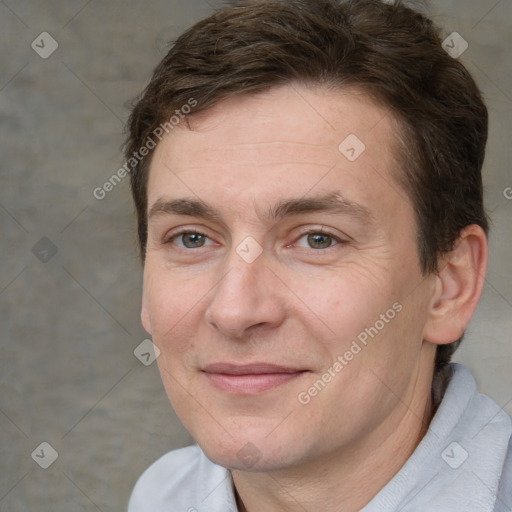 Joyful white adult male with short  brown hair and brown eyes