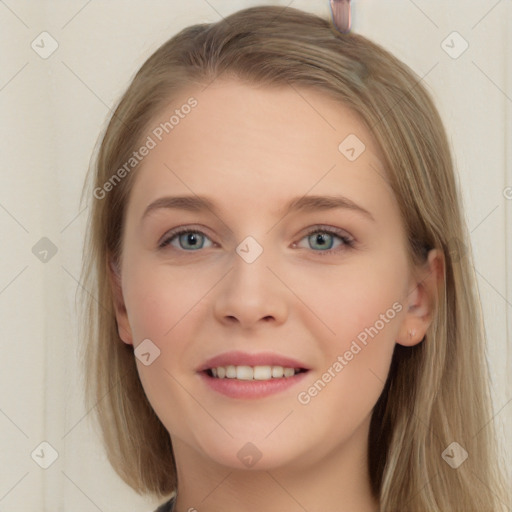 Joyful white young-adult female with long  brown hair and blue eyes