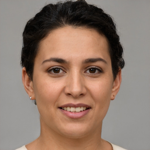 Joyful white young-adult female with short  brown hair and brown eyes