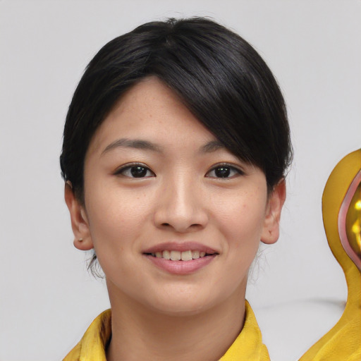 Joyful white young-adult female with short  black hair and brown eyes