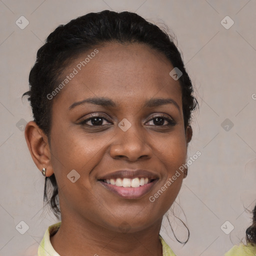 Joyful black young-adult female with medium  brown hair and brown eyes