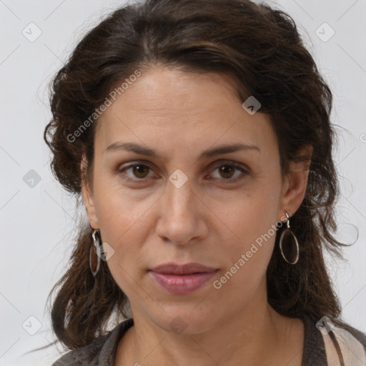 Joyful white adult female with long  brown hair and brown eyes