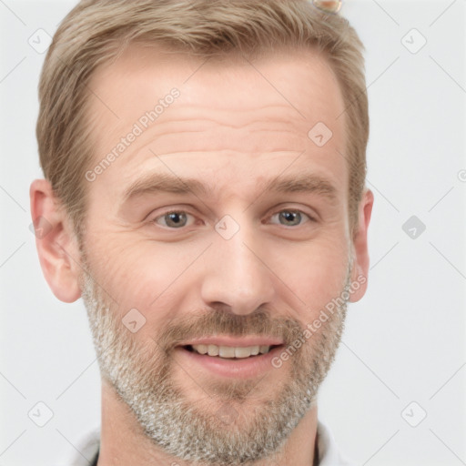 Joyful white adult male with short  brown hair and grey eyes