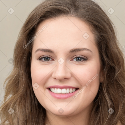 Joyful white young-adult female with long  brown hair and green eyes