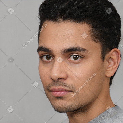 Neutral white young-adult male with short  black hair and brown eyes