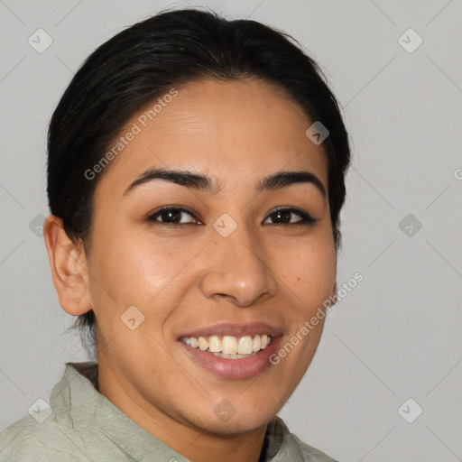 Joyful latino young-adult female with medium  brown hair and brown eyes