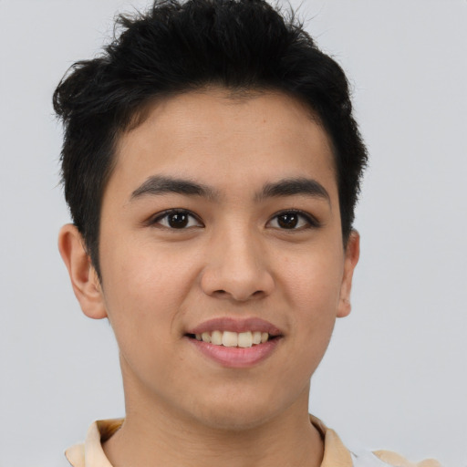 Joyful asian young-adult male with short  brown hair and brown eyes