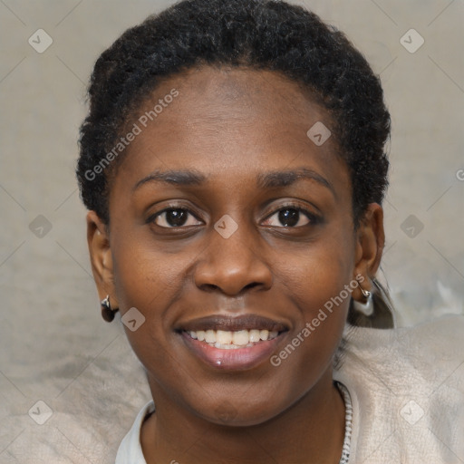 Joyful black young-adult female with short  brown hair and brown eyes