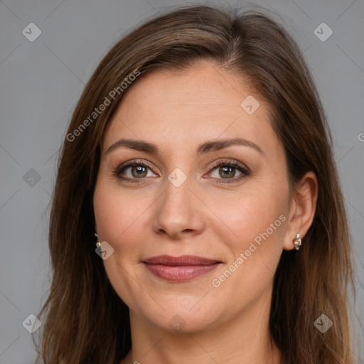 Joyful white adult female with long  brown hair and brown eyes