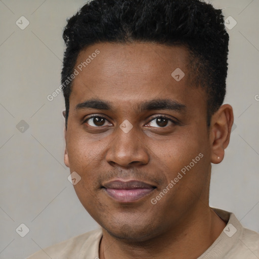 Joyful black young-adult male with short  black hair and brown eyes