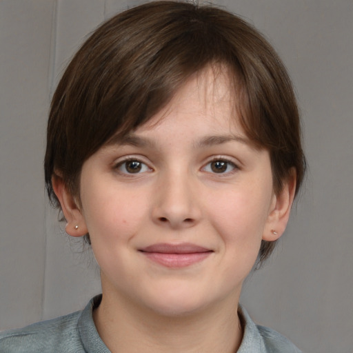 Joyful white child female with medium  brown hair and grey eyes